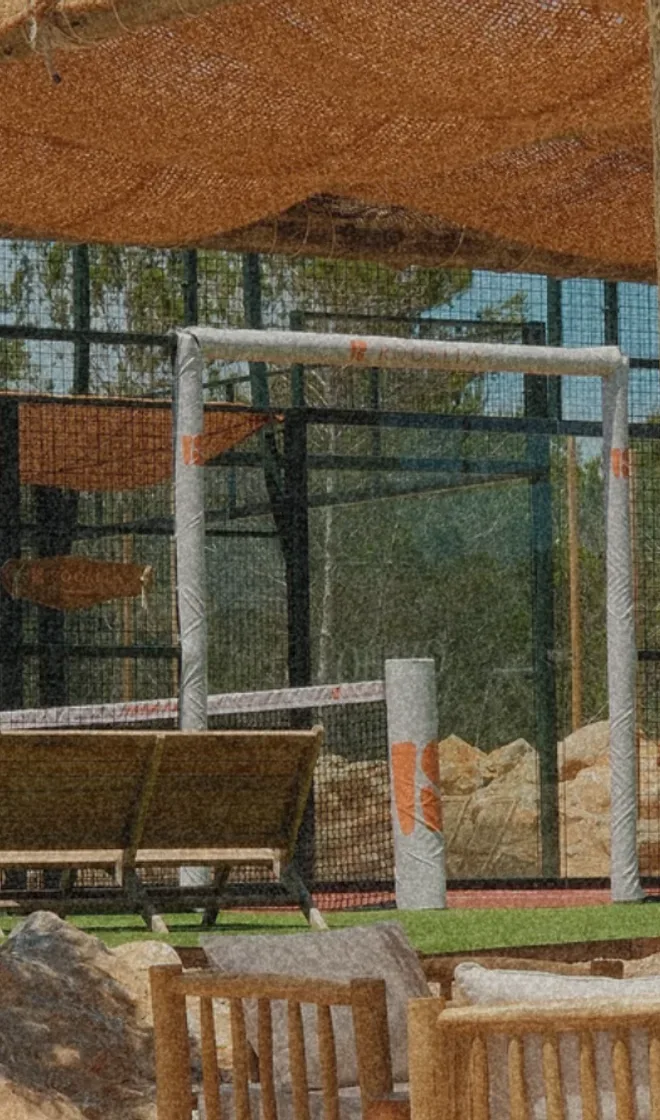 A padel court on Formentera under a reed canopy